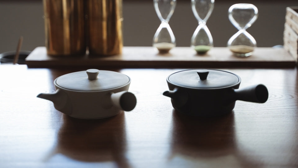 Handcrafted Japanese Sencha Teapot Black & White on a wooden table in a zen room
