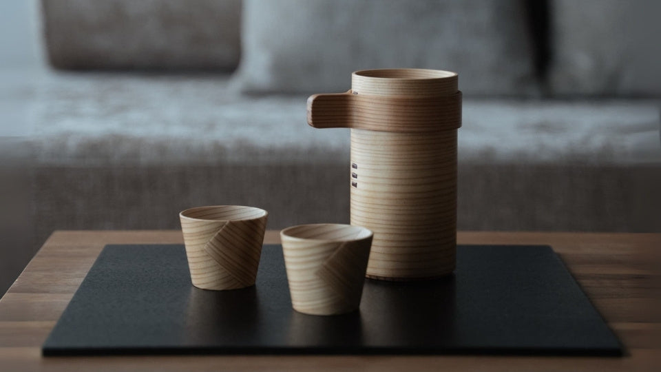 Japanese cedar sake cup set on a wooden table