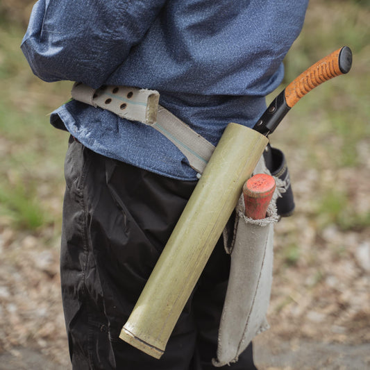 Bamboo craftsman's belt with tools for harvesting