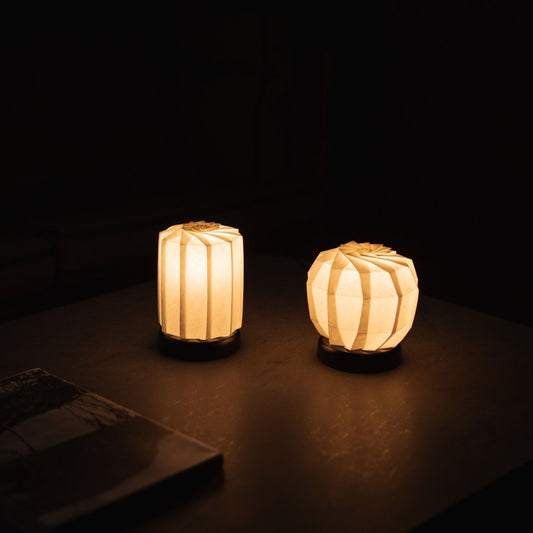 Two types of Japanese Origami Paper Table Lamp "Flower of Light" emit warm glow and calm atmosphere in the dark room