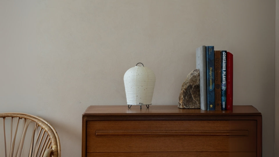 Japanese Paper Table Lamp "PAPERSON 01" on a wood table in Japandi room - Unique table lamps for living room & bedroom