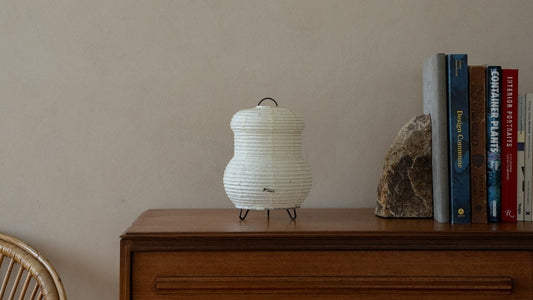Japanese Paper Table Lamp "PAPERSON 03" on a wood table in Japandi room - Wabi-Sabi paper night lamp for bedroom