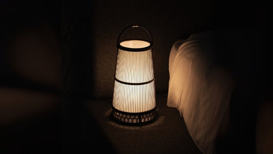Japanese Bamboo Floor Lamp "Hagoromo" emits warm glow and beautiful shadow with wabi sabi atmosphere in the Japandi bedroom.