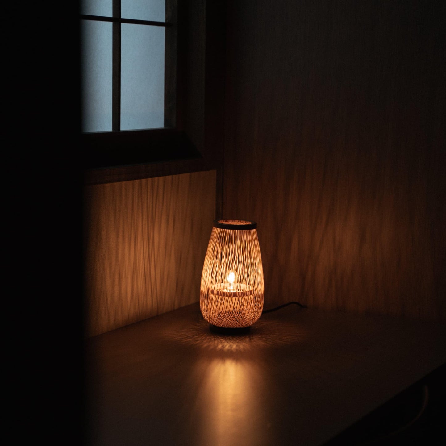 Japanese bamboo table lamp on a table in Japanese bedroom