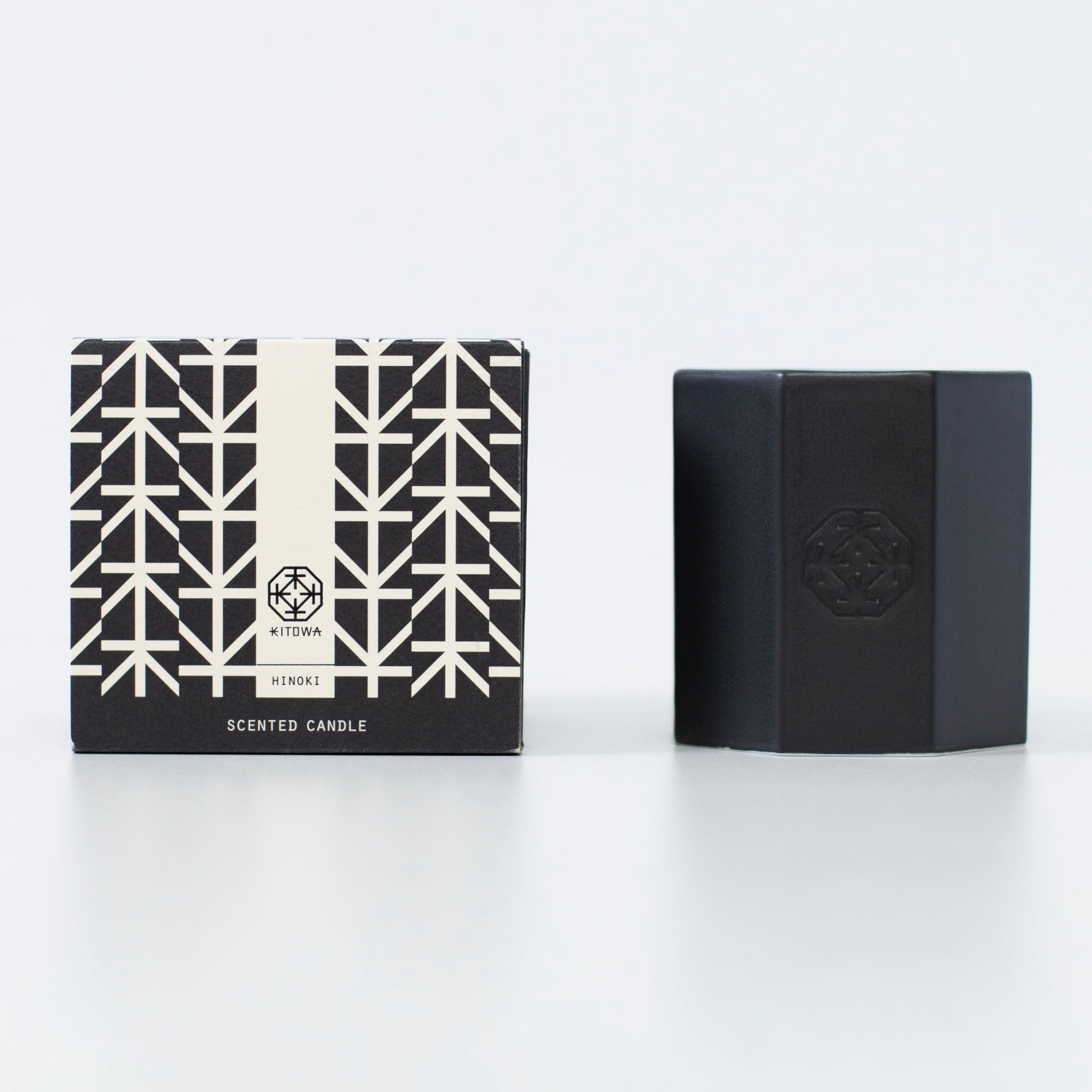 A Japanese black scented candle made of Arita ware, offering a relaxing wooden fragrance.