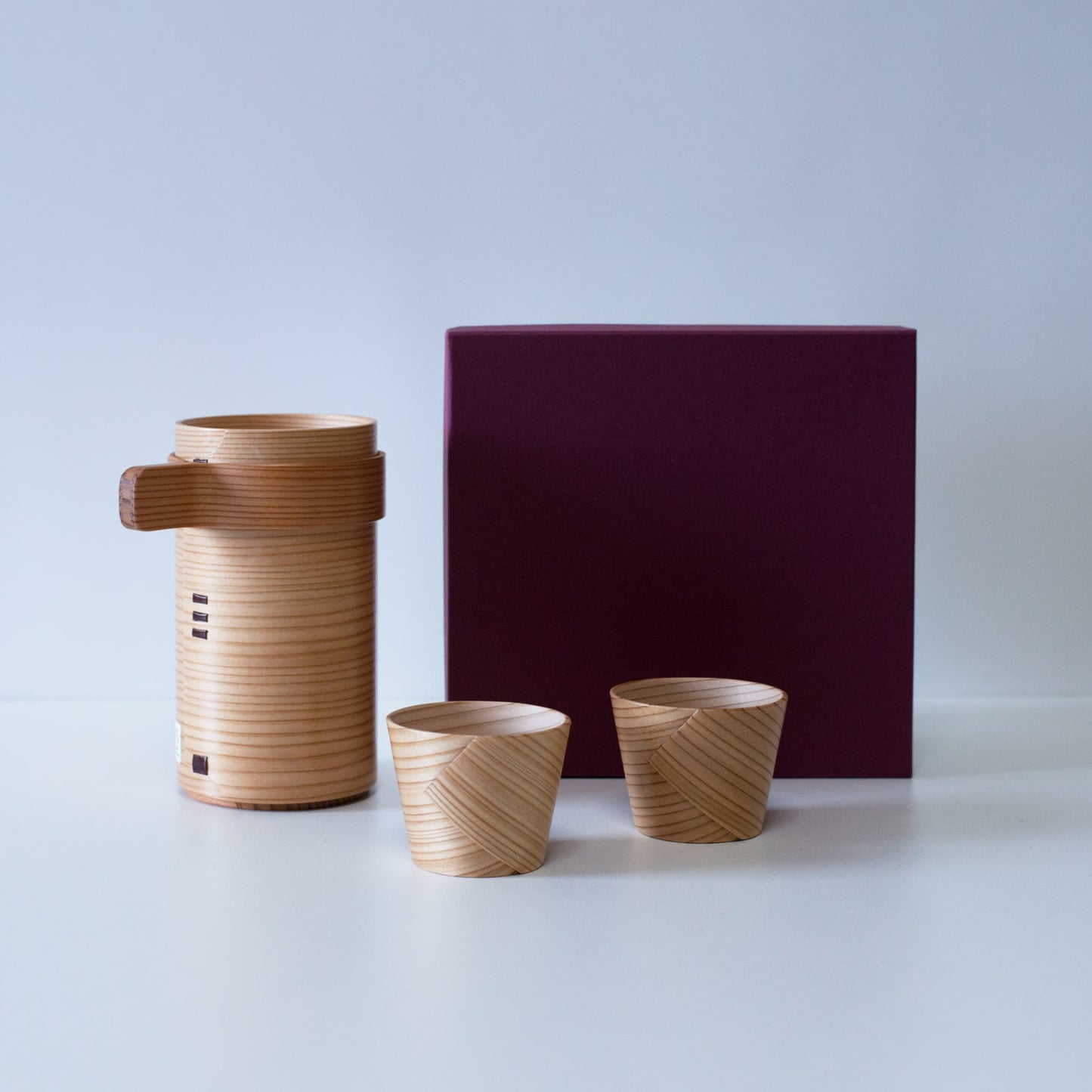Japanese sake set made of Akita cedar by a 76-year-old craftsman using traditional Magewappa bending techniques.