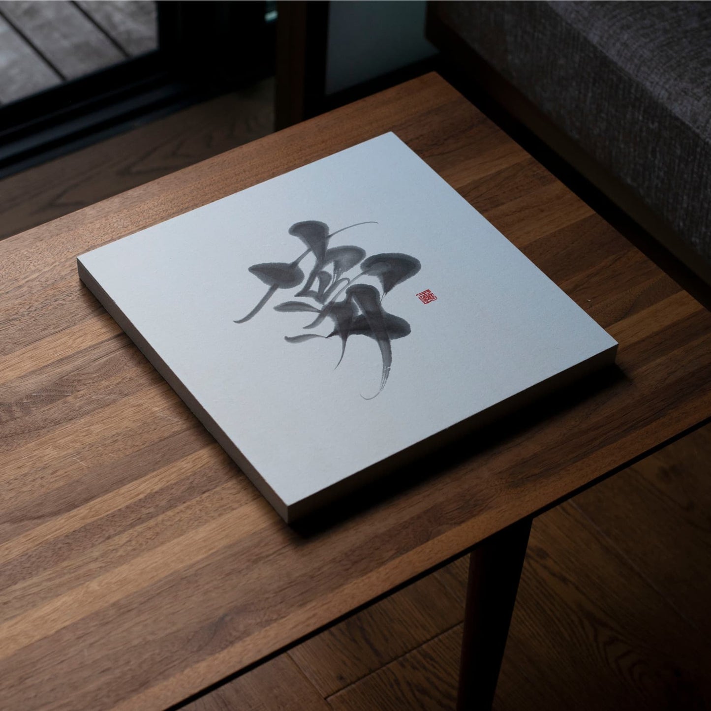 Angled_Top_View_of_Dream_Calligraphy_Panel_on_Wooden_Table
