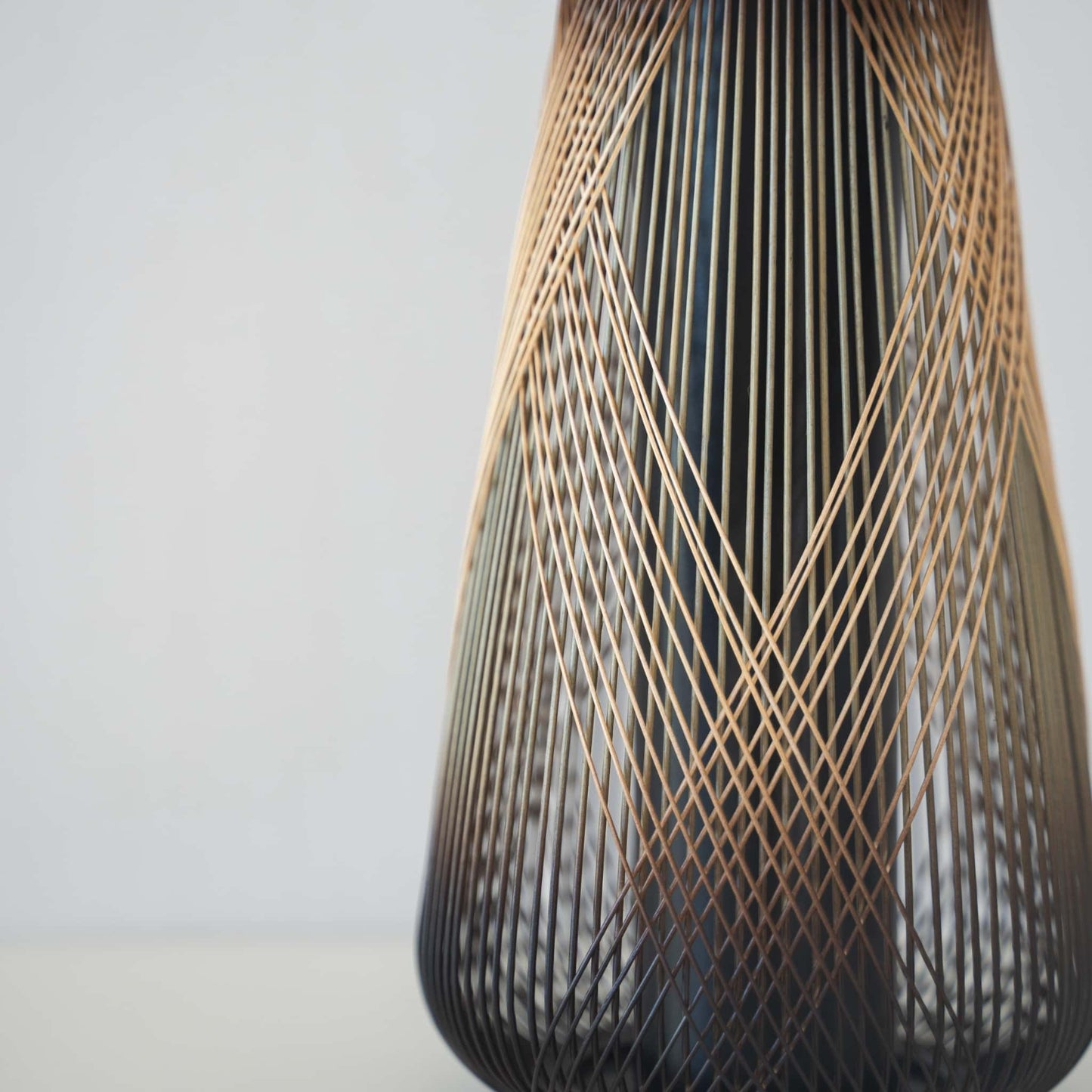 Detail of Japanese bamboo Ikebana vase handcrafted with traditional Japanese bamboo craft techniques from Shizuoka Japan
