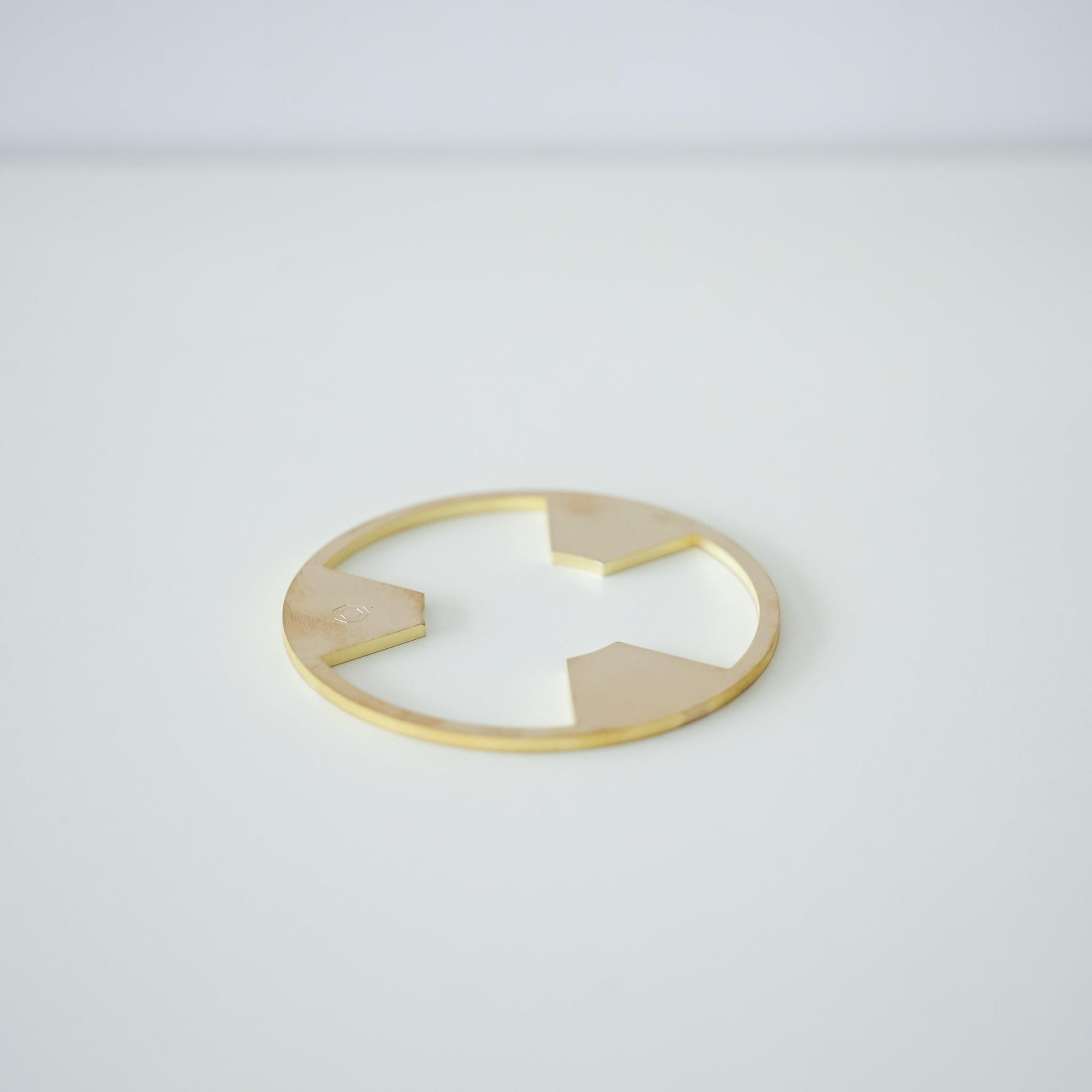 A brass stand for a traditional Banko ware coffee dripper.