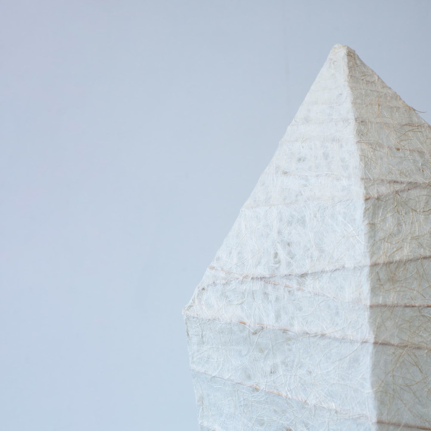 Close-up view of the top of a Japanese paper lamp with ice stone design, showing the beautiful hand-crafted washi paper patterns