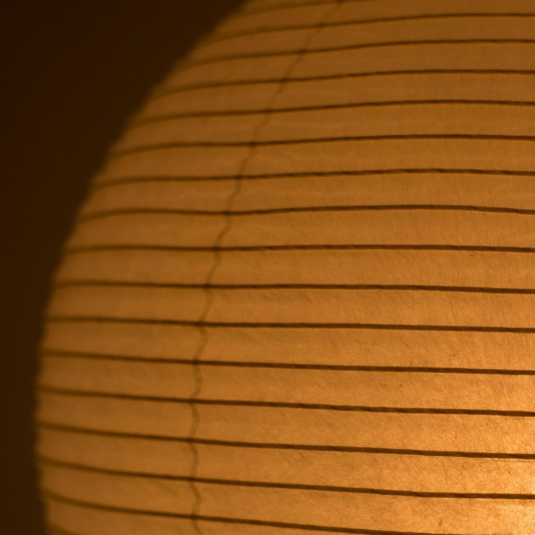 Warm, diffused lighting from the Japanese paper floor lamp "Chochin lamp 03" highlights the beauty of washi paper