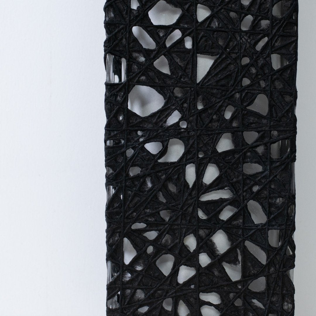 Close-up of black Japanese paper floor lamp ME-LOOK 01, Melook washi web texture detail