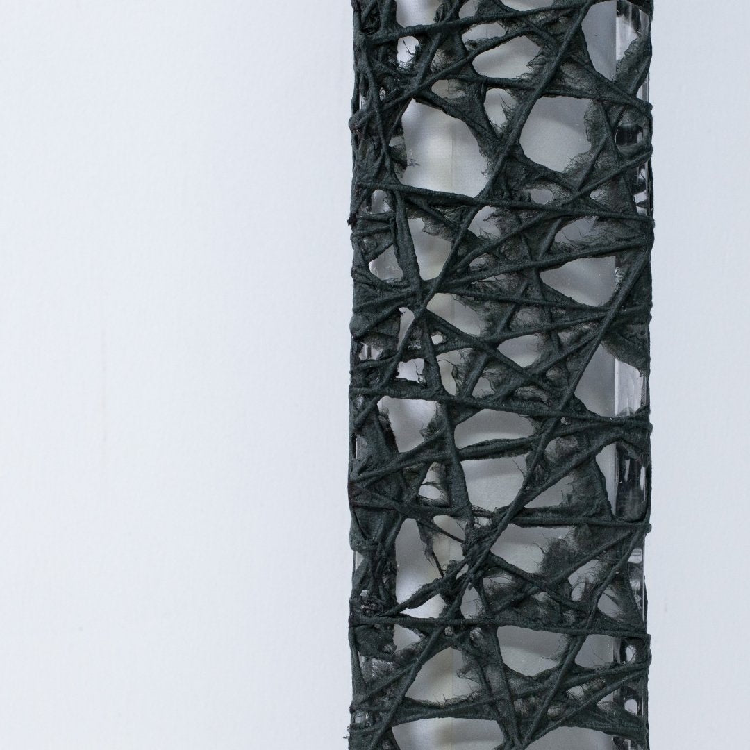 Close-up of black Japanese paper floor lamp ME-LOOK 02, Melook washi web texture detail