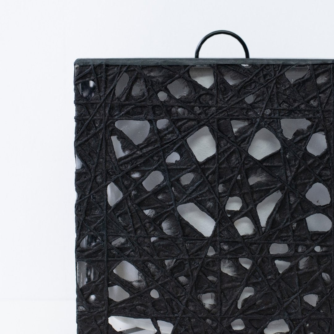 Close-up of black Japanese paper floor lamp ME-LOOK 03, Melook washi web texture detail