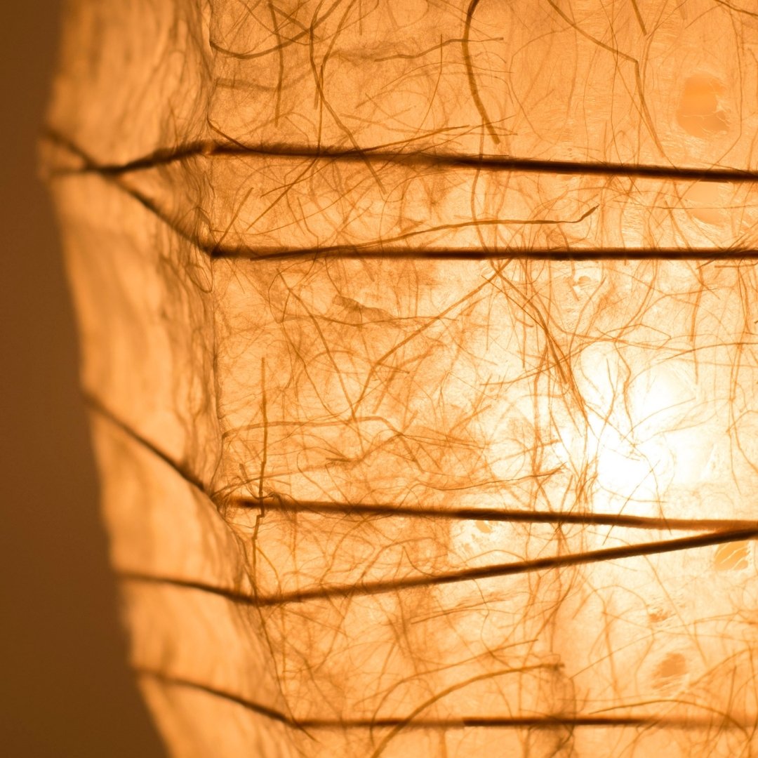 Soft ambient lighting detail from Japanese Paper Floor Lamp “Paper Stone” Small - washi standing lamp for living room