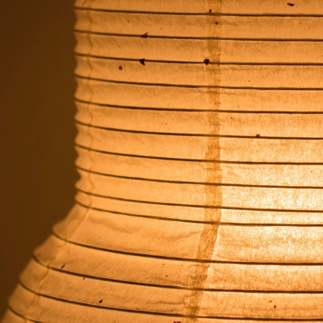 Soft ambient lighting detail from Japanese paper table lamp 'PAPERSON 02' - paper table lamp ideal for bedside tables