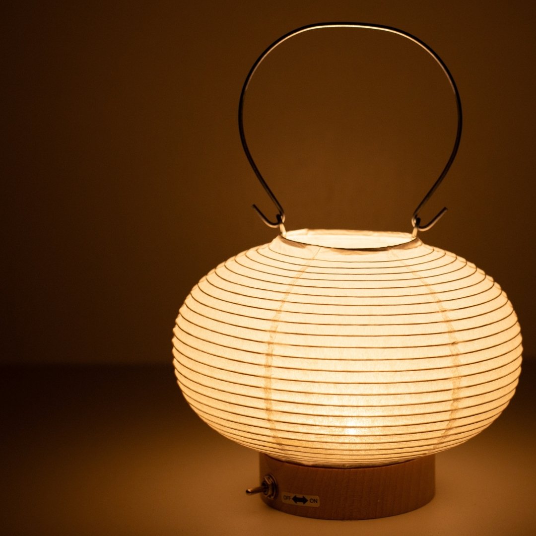 Close-up of Japanese paper table lamp RIN 03, warm glow rounded Japanese table lamp for living room & bedroom
