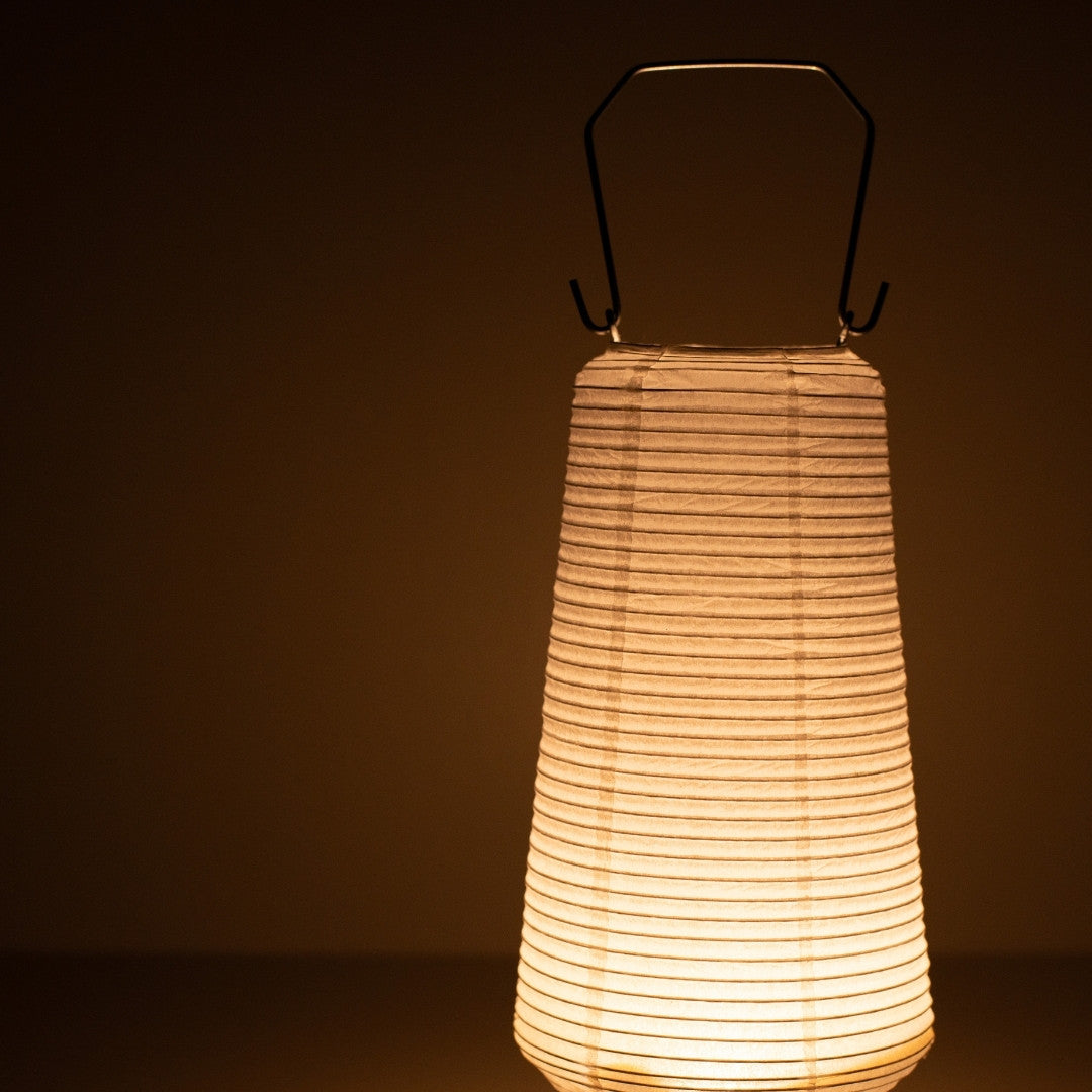 Close-up of slim Japanese paper table lamp RIN 04, warm vertical Japanese table lamp glow