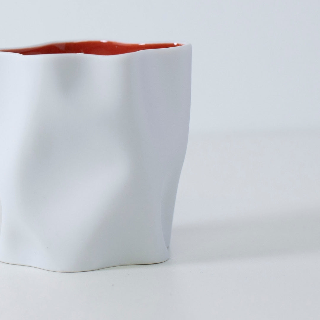AKAFUJI Japanese scented candle in white Seto porcelain with red interior, inspired by Hokusai’s Fuji