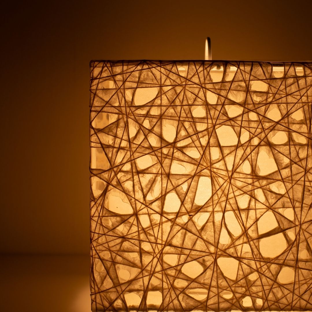 Close-up glowing white Japanese floor lamp ME-LOOK 03, intricate Melook washi paper shade