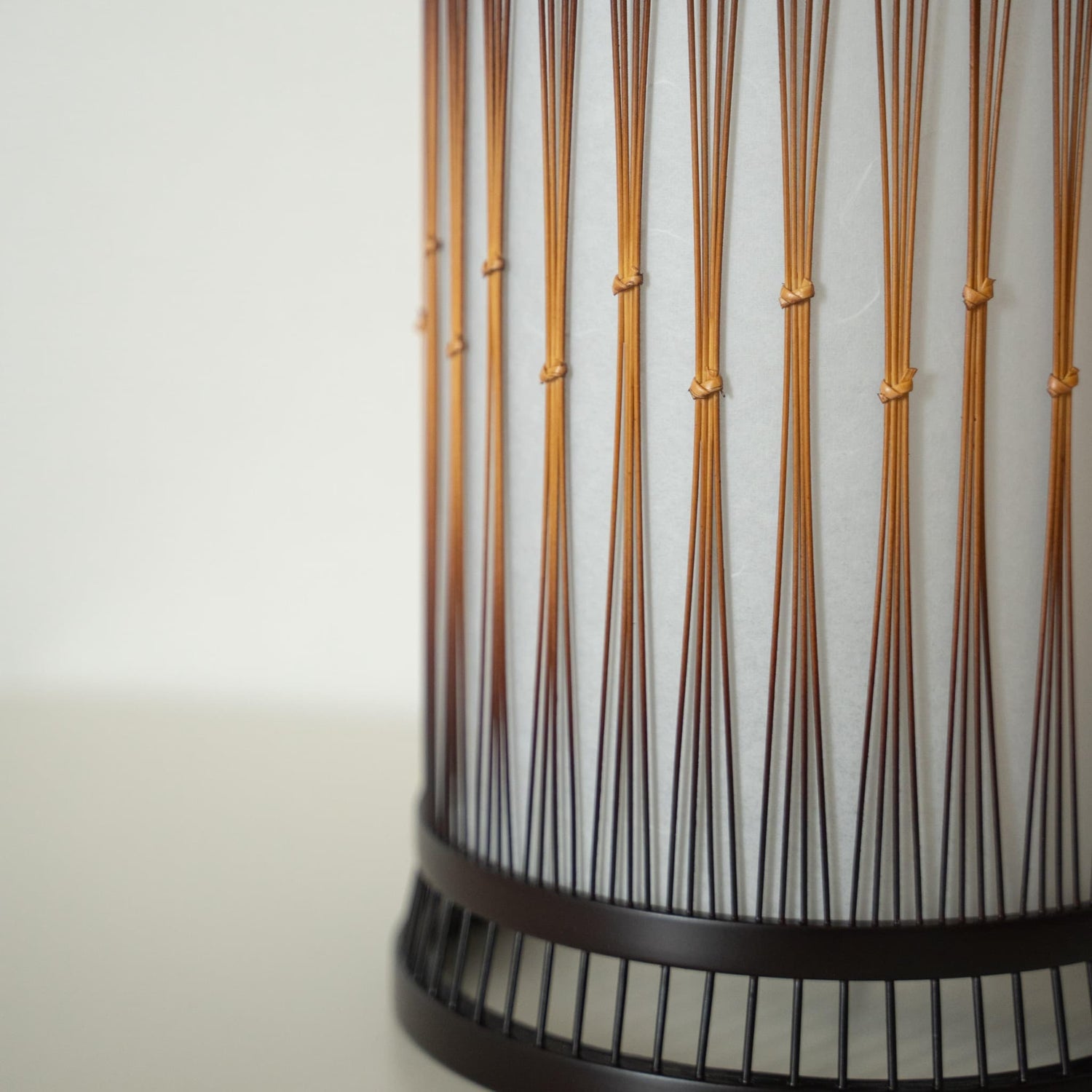 A beautiful bamboo floor lamp crafted with finely processed, delicate bamboo bound together with rattan.
