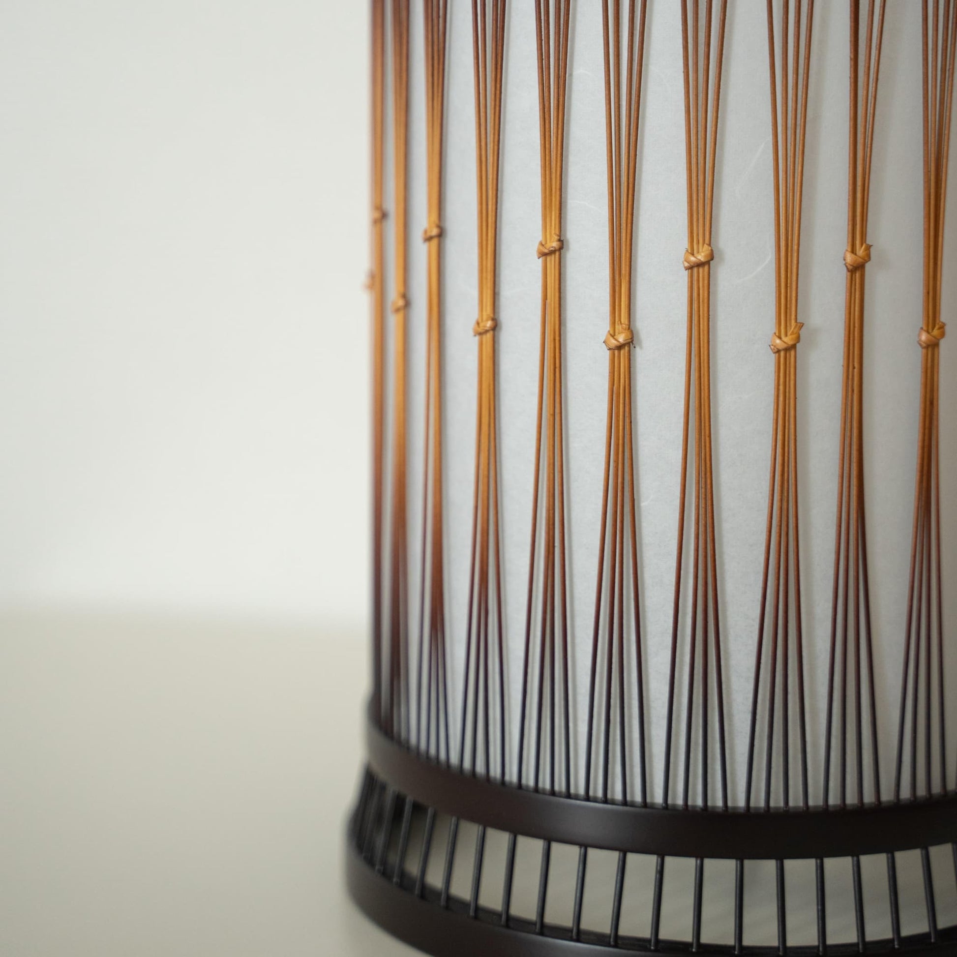 A beautiful bamboo floor lamp crafted with finely processed, delicate bamboo bound together with rattan.