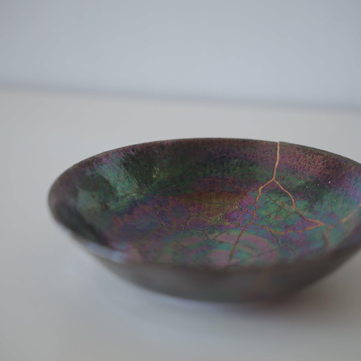 Close-up of Kintsugi Bowl "Owl Nebula" side, highlighting the intricate Kintsugi repairs