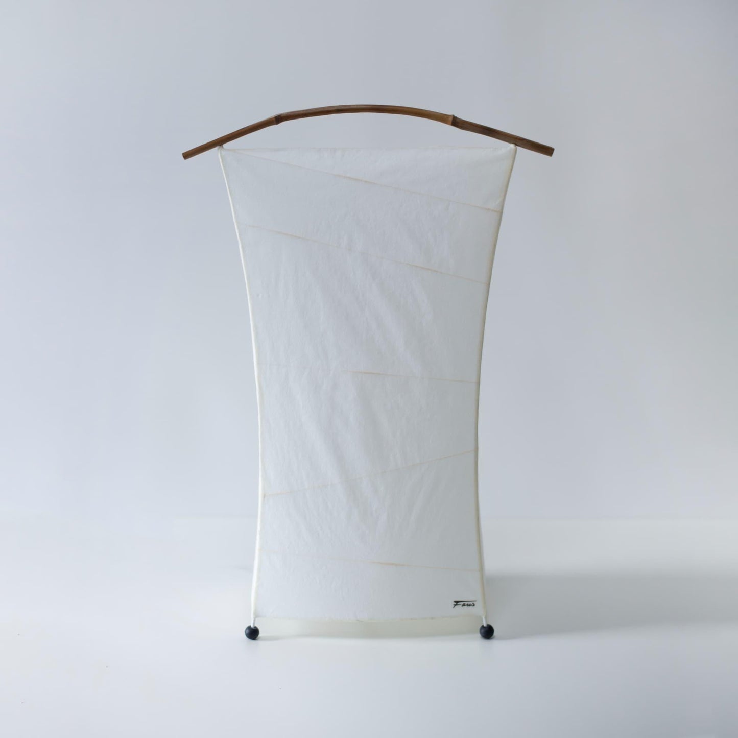 Unique bean-shaped floor lamp crafted with Gifu lantern techniques and 1300-year-old Mino washi paper.