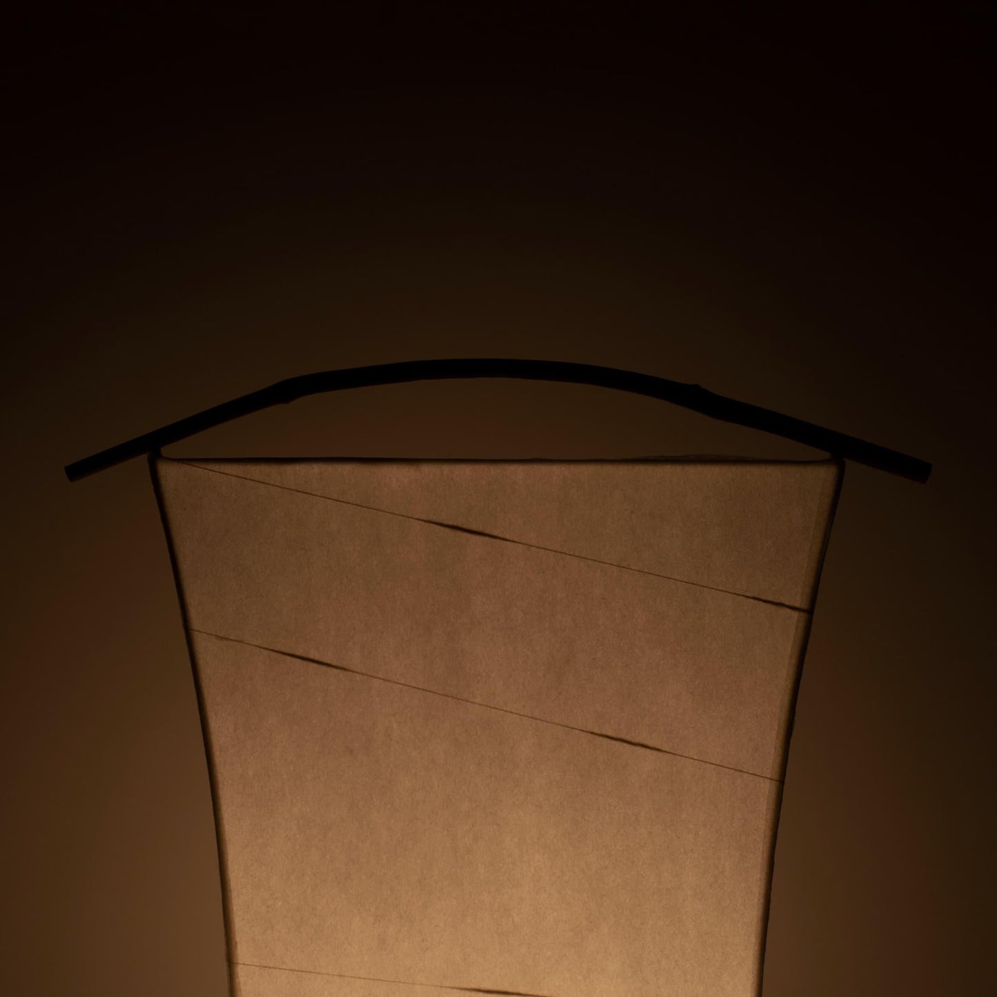 Detail of a unique paper floor lamp crafted with Gifu lantern techniques and 1300-year-old Mino washi paper, showing the intricate patterns and textures of the washi paper.