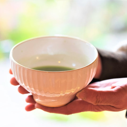 Close-up of a Japanese matcha chawan bowl handcrafted by Buzan Kiln in Gifu, Japan, showcasing fine porcelain texture and the soft sheen of Mino Ware pottery.