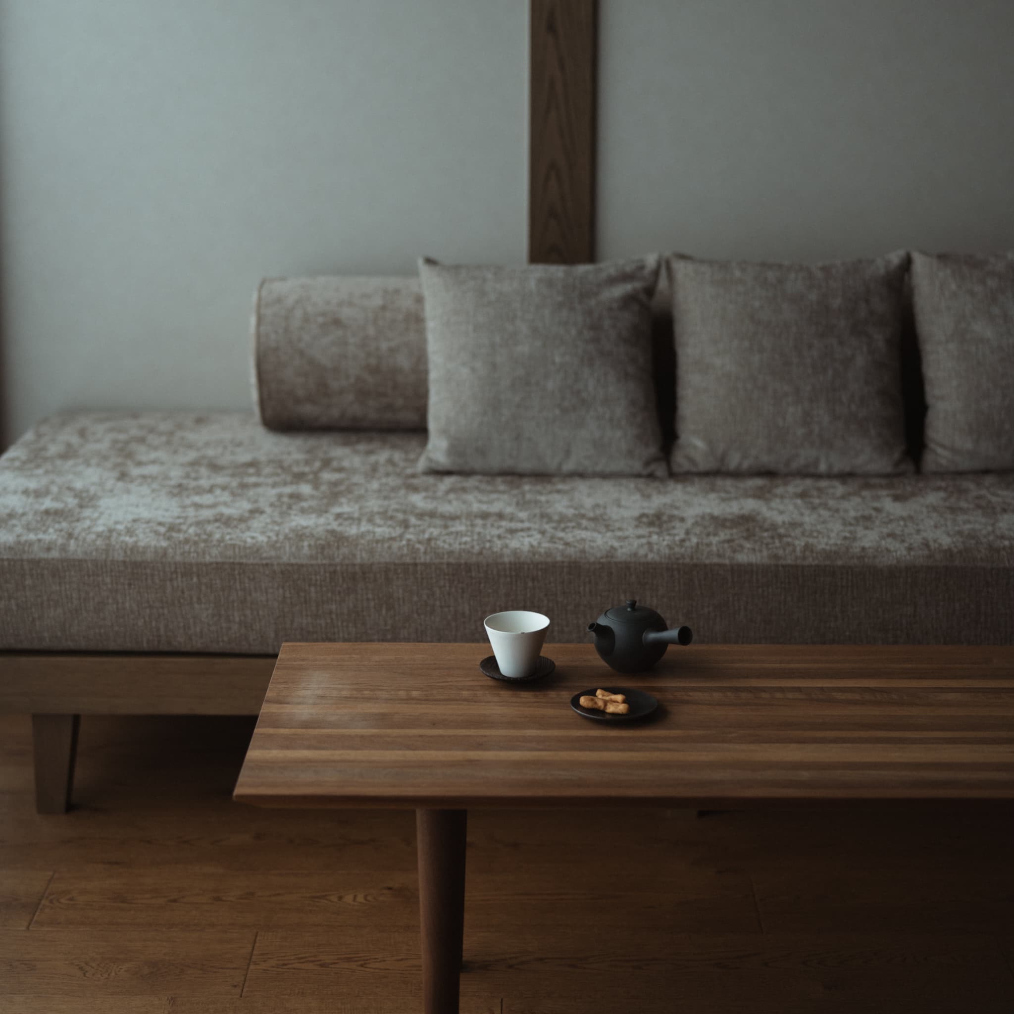 Japandi style living room with teapot and teacup set on a wooden table