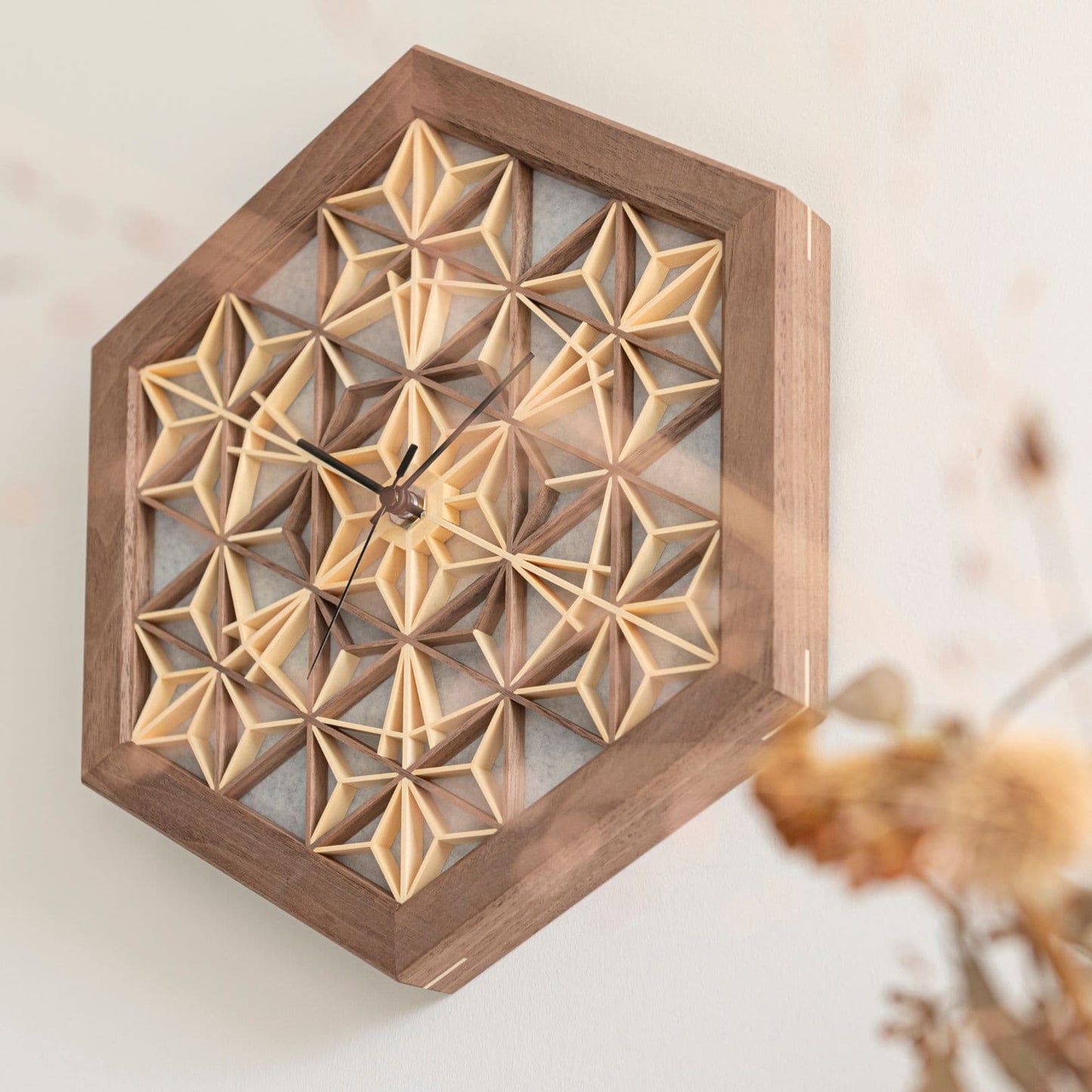 Japanese kumiko clock on a wall in a Japandi living room.