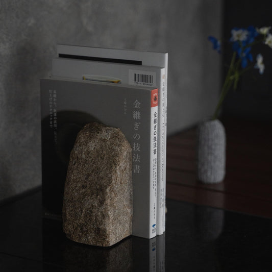 A Japanese Aji Stone Book End on a table in living room