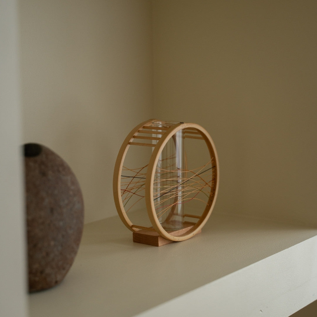 Japanese Bamboo Flower Vase “Flowing Wind” on a white shelf - Unique ikebana flower vase for Japandi style interiors