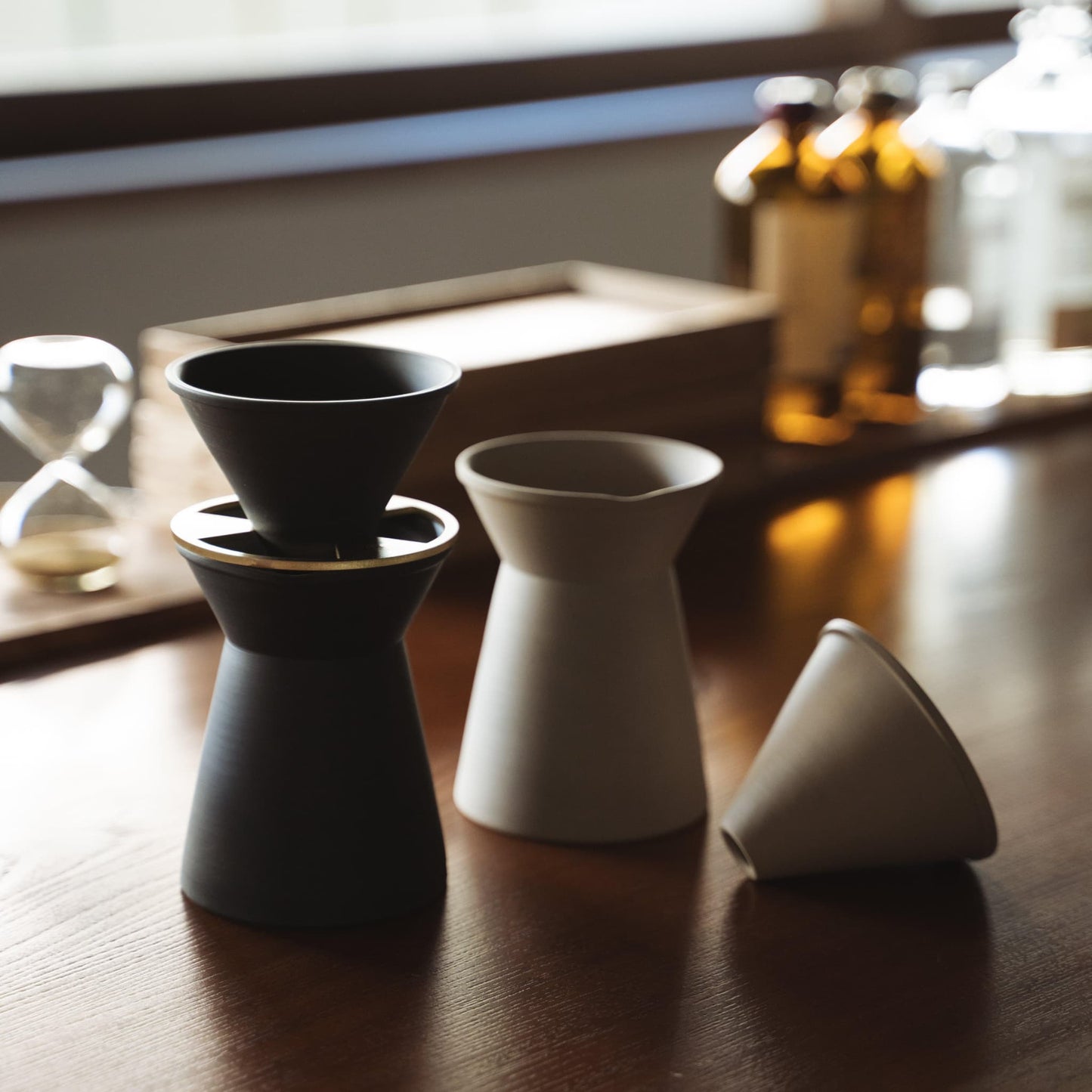 Pair of Black and White Banko yaki Coffee Servers on Wooden Table