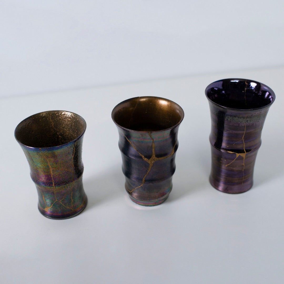 Japanese kintsugi potteries with rainbow and magenta luster | wabi sabi design by Taku Nakano