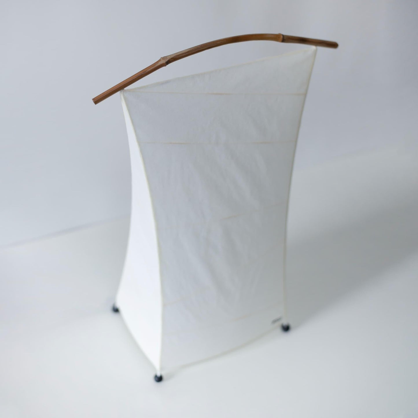 Overhead view of Japanese Paper Floor Lamp "NOW" against a white background