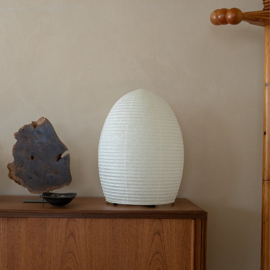 Japanese Paper Floor Lamp "paper moon 11" on a wood table in Japandi style room - standing floor lamp for living room