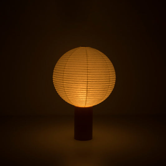 Japanese paper lamp "TORCHIN CERCLE" emitting a warm glow, handcrafted in Yame, Fukuoka, Japan, known for its traditional Yame lanterns.