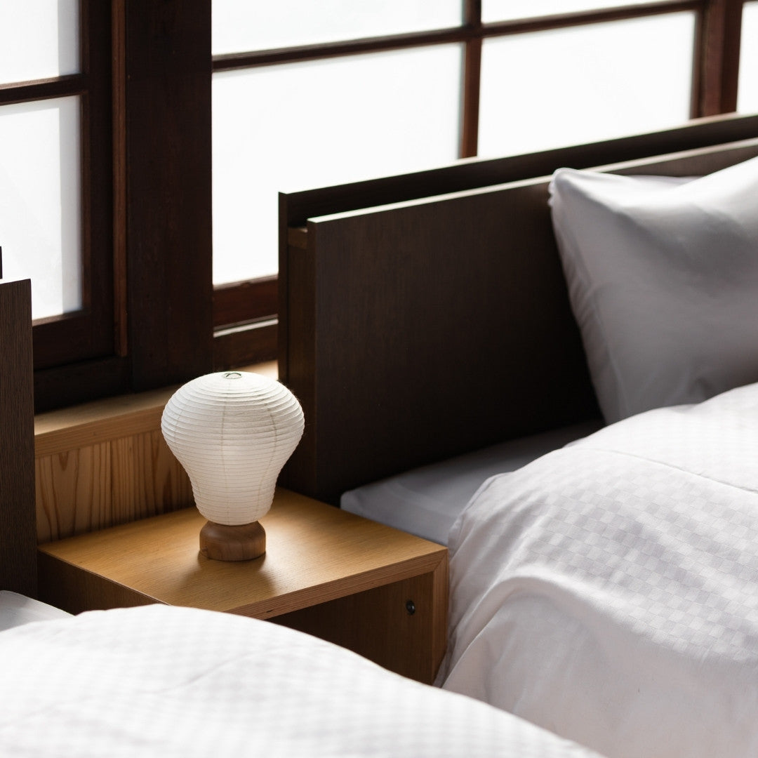 Japanese Paper Table Lamp "Balloon" on a bedside table in a bedroom