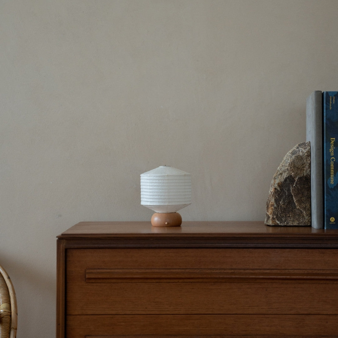 Japanese Paper Table Lamp "Mini Square" on wooden shelf in Japandi style living room – Unique Portable paper lamp for Japandi interior