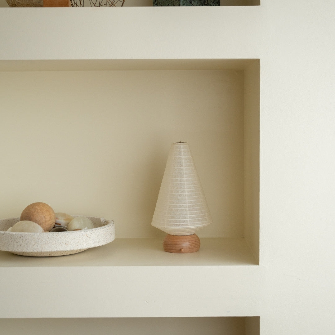 Japanese Paper Table Lamp "Mini Tree" on a white shelf in Japandi style room – Unique portable lamps for bedside tables
