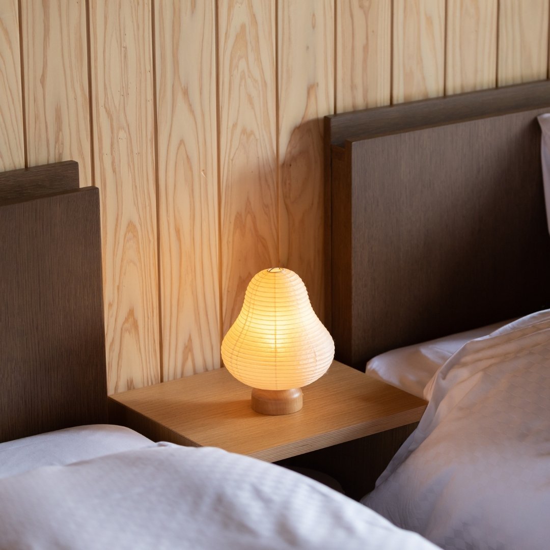 Japanese Paper Table Lamp "Mountain" on a bedside table