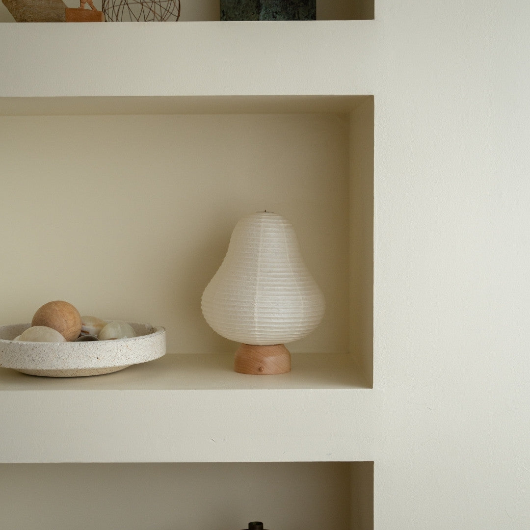 Japanese Paper Table Lamp "Mountain" on a white shelf in Japandi style room – Unique portable lamps for Japandi living room