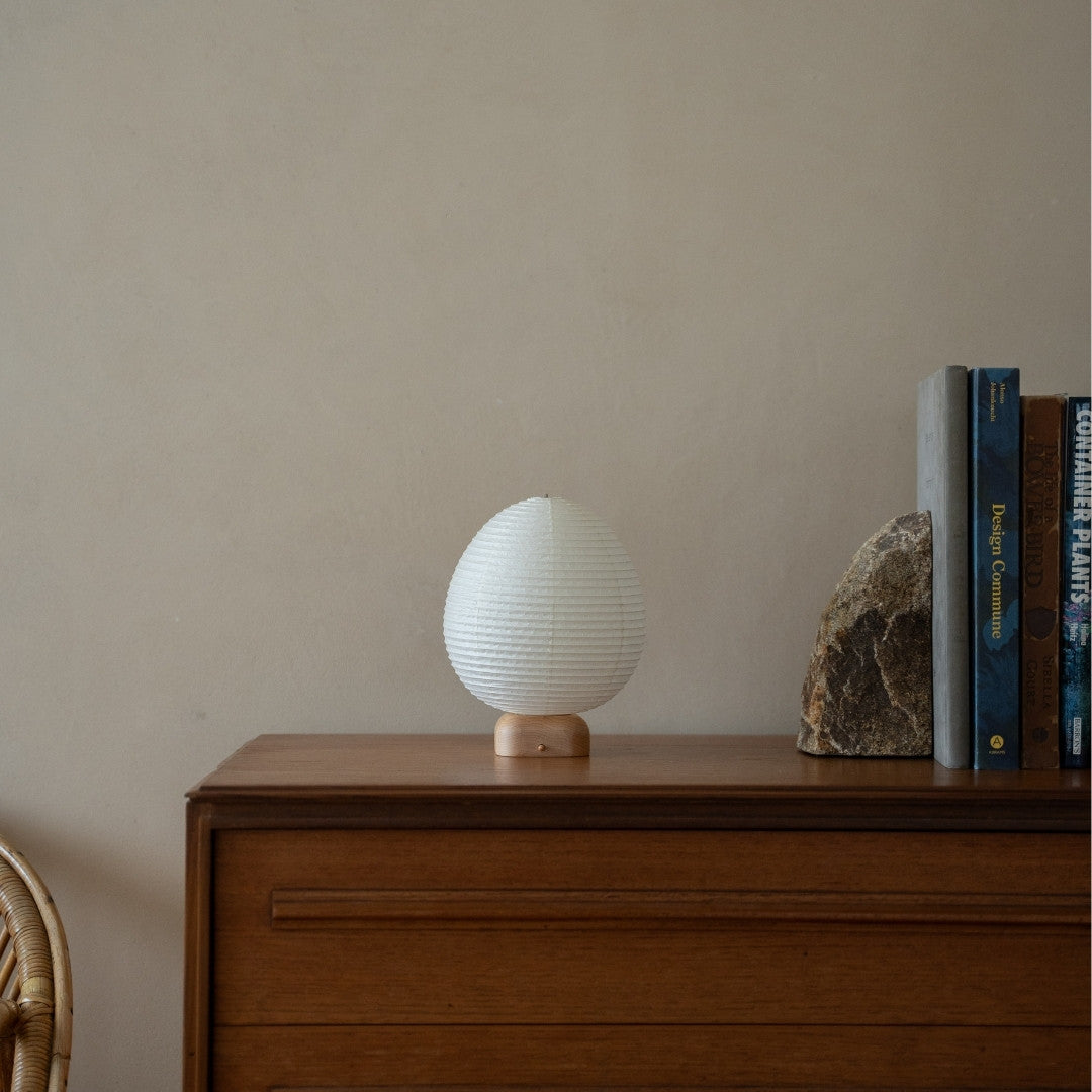 Japanese Paper Table Lamp "Ostrich" on wooden shelf in Japandi style living room – Unique portable night lamp for bedroom