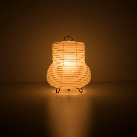 Japanese Paper Table Lamp "PAPERSON 02" illuminating a dark room - Unique Washi Paper bedside lamp