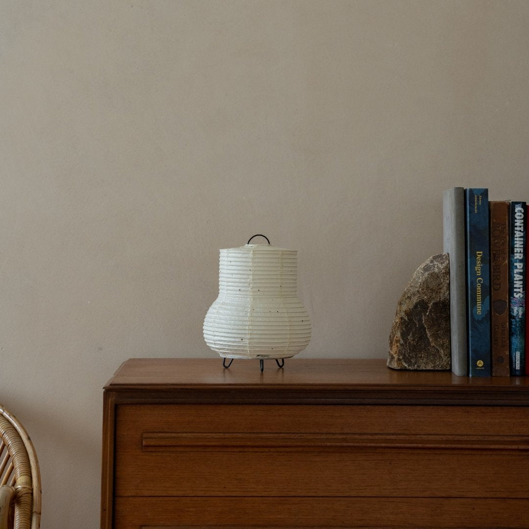 Japanese Paper Table Lamp "PAPERSON 02" on a wood table in Japandi living room - Unique bedside lamp for Japandi interior