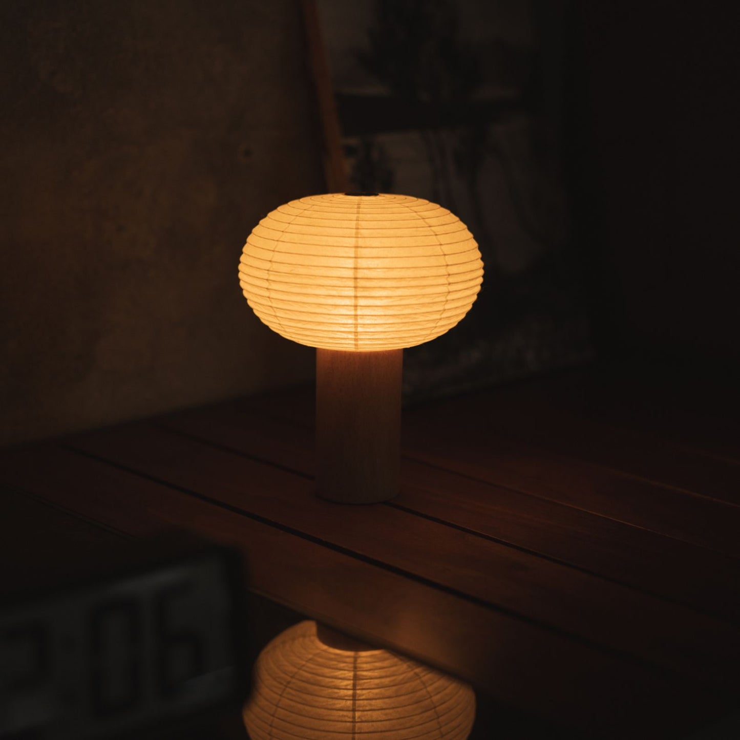 Japanese Paper Table Lamp "TORCHIN OVAL" Placed on a Living Room Console Table