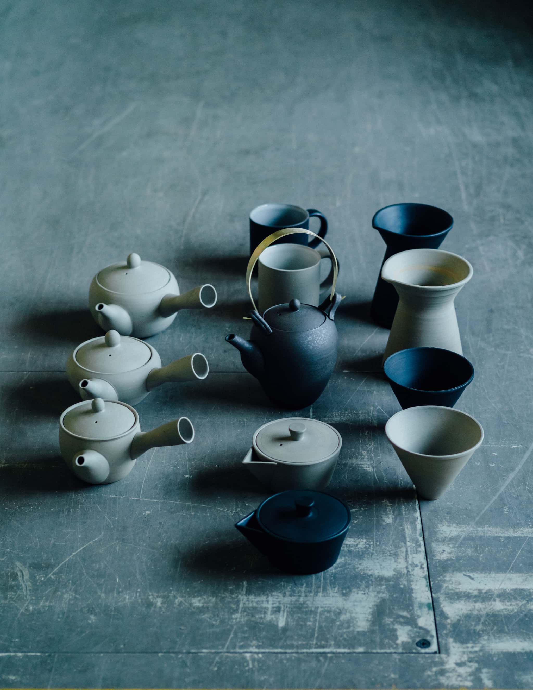Black and white Japanese teapots and coffee servers.