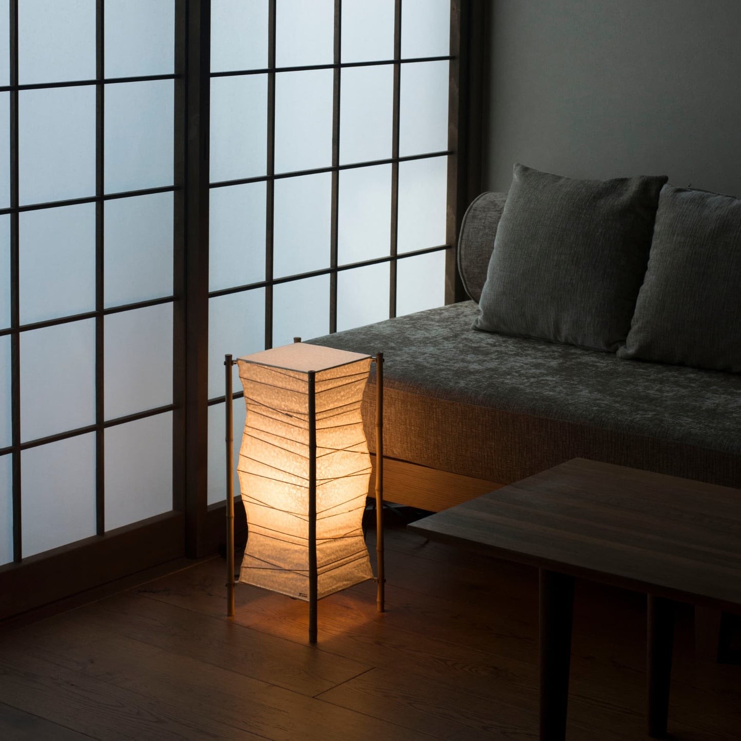 Japanese paper floor lamp "Nippon 02" in a Japandi living room.